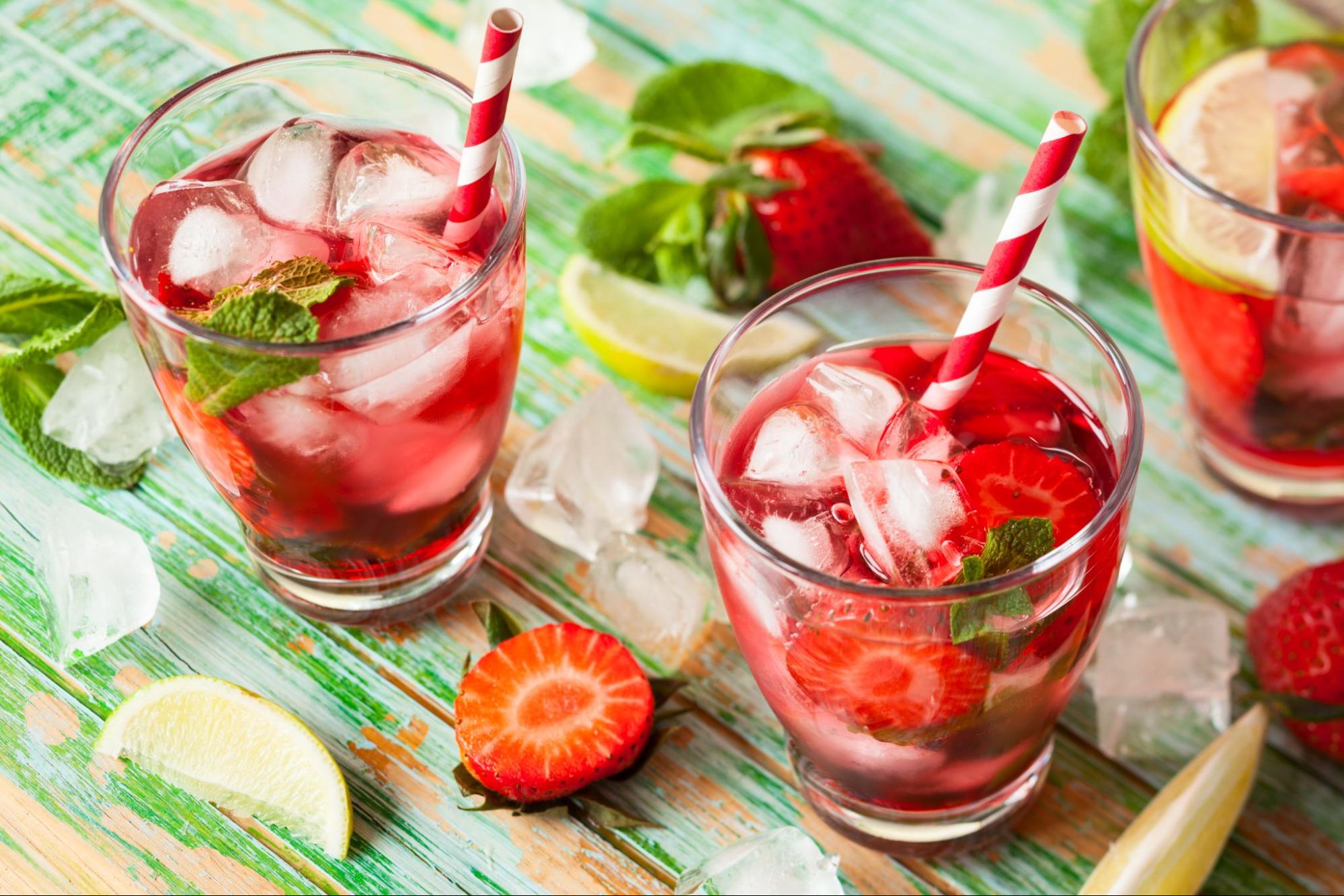 refreshing glass of strawberry lemonade with a red and white straw ©Kolpakova Svetlana